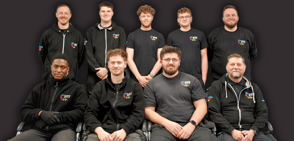 Yes Warehouse Team team members in the warehouse in a group photo