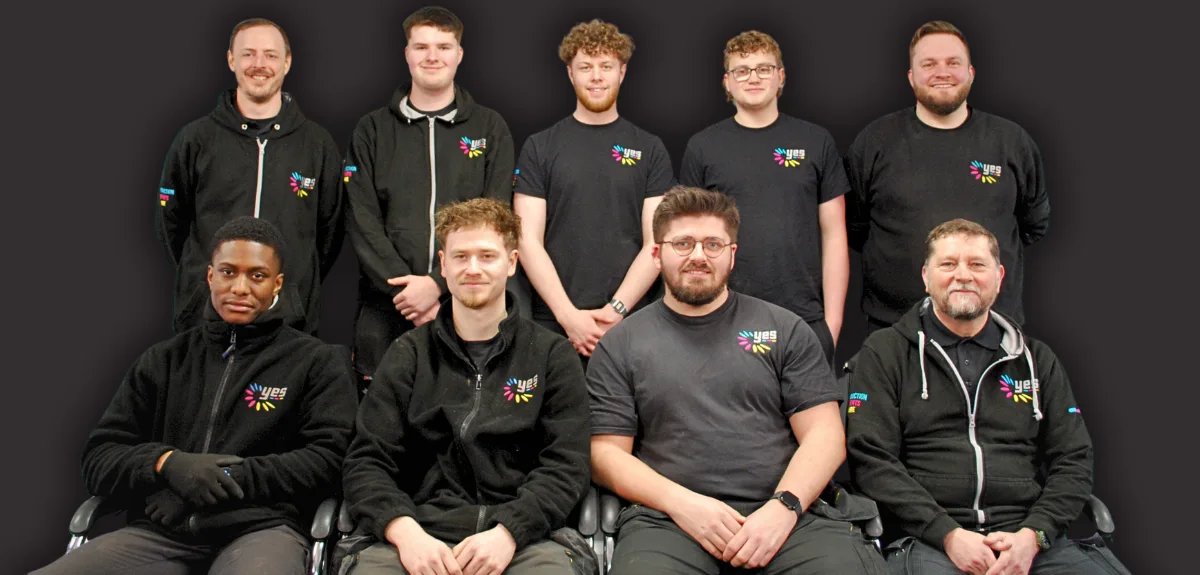 team members in the warehouse in a group photo